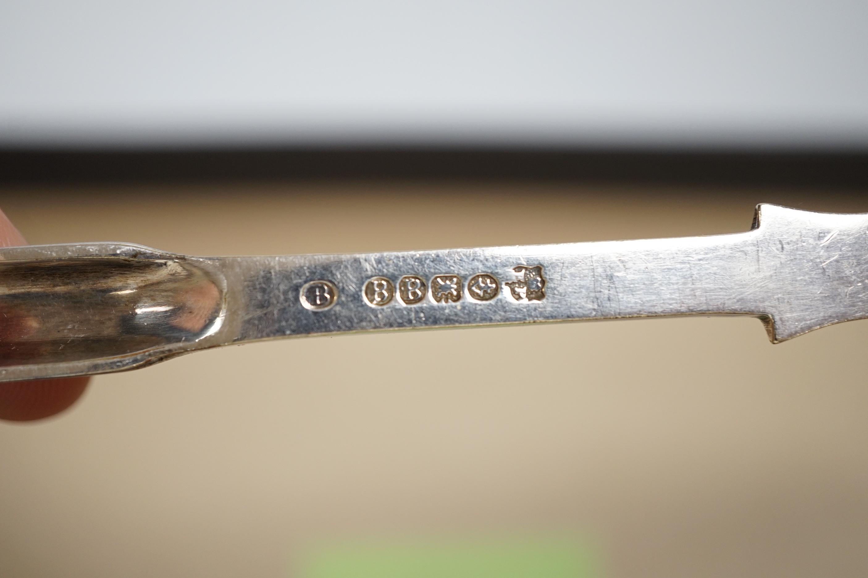 An early to mid 20th century Georg Jensen sterling and hardwood server, 26.1cm and a similar caddy spoon, together with other silver flatware, Scandinavian flatware and a plated marrow scoop.